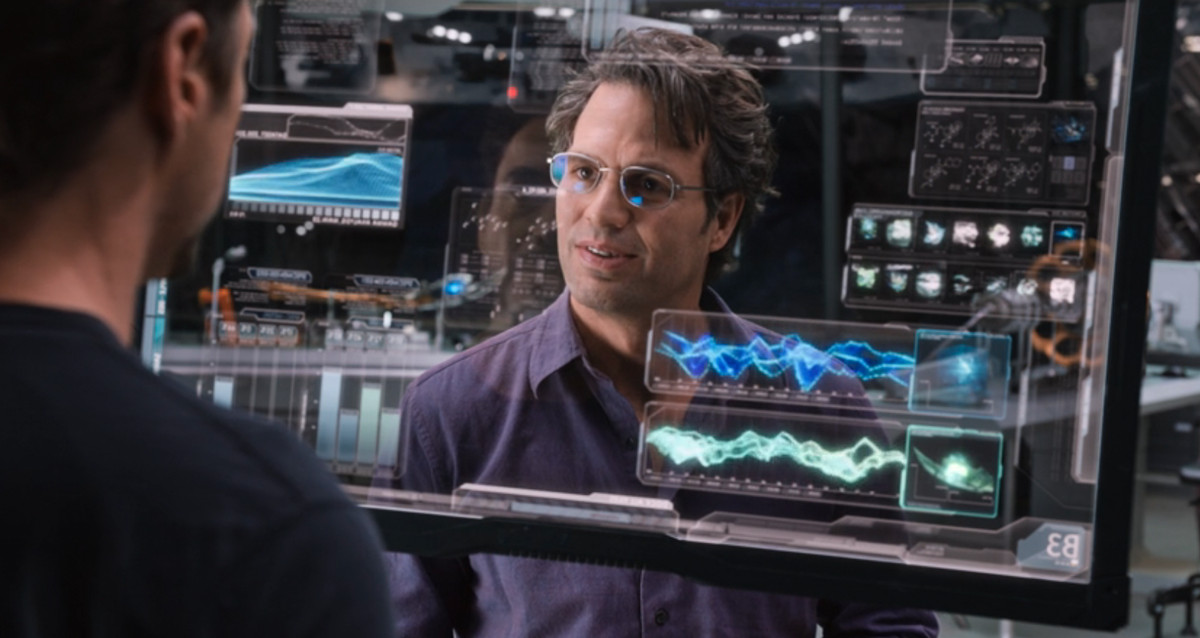bruce looking at tony through glass, tony’s reflection like a ghost 