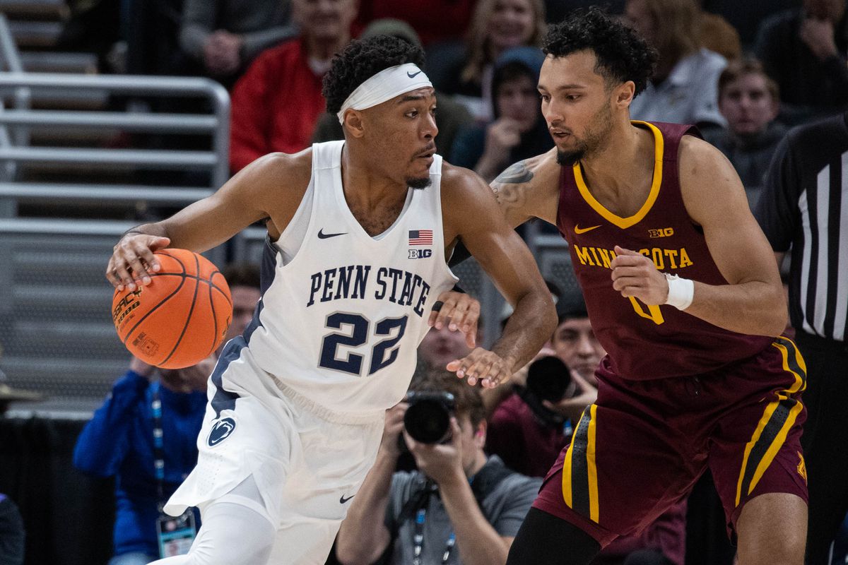 Penn State Nittany Lions guard Jalen Pickett (22) dribbles the ball while Minnesota Golden Gophers guard Payton Willis (0) defends in the first half at Gainbridge Fieldhouse.