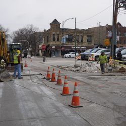 Utility work outside the ballpark. A trench being dug across Waveland Avenue, at Clifton Avenue