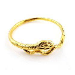 <a href="http://concretepolishjewels.com/bigcartel-items/serpent-bangle-in-gold">Serpent Bangle in Gold</a>, $161.25 (reg. $215)