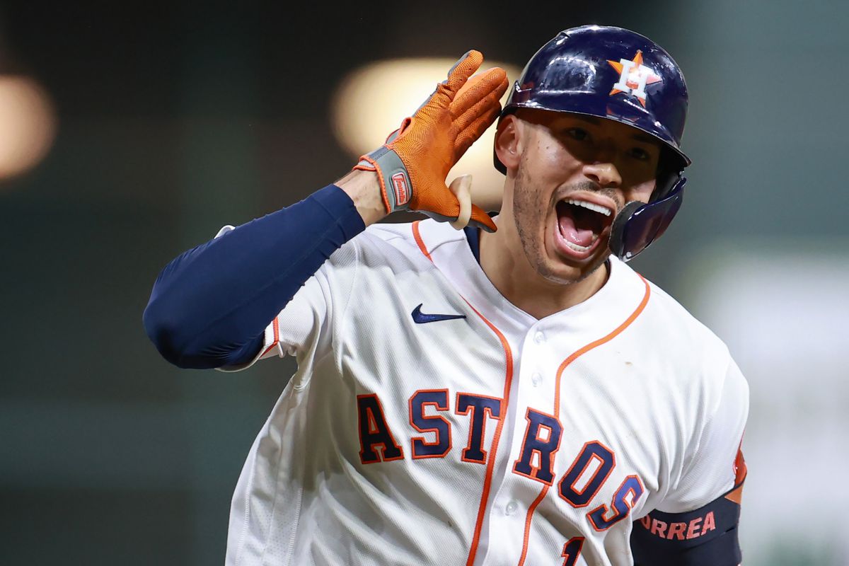 Carlos Correa #1 of the Houston Astros reacts to hitting a solo home run during the seventh inning against the Boston Red Sox during Game One of the American League Championship Series at Minute Maid Park on October 15, 2021 in Houston, Texas.