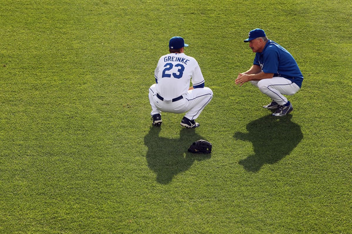 Here's Bob McClure and Zack Greinke squatting together during their time as Royals.