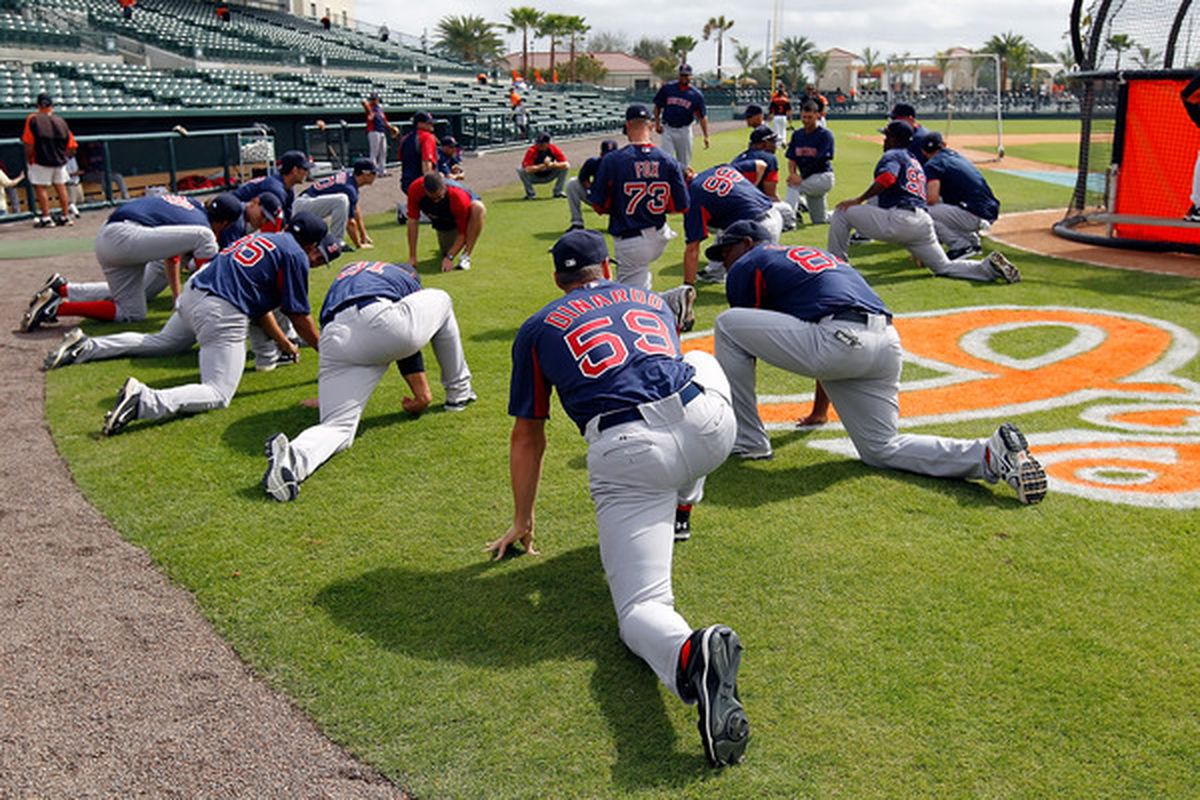 SARASOTA, FL - MARCH 05:  The Boston Red Sox stretch just before the start of the Grapefruit League Spring Training Game against the Baltimore Orioles at Ed Smith Stadium on March 5, 2011 in Sarasota, Florida.  (Photo by J. Meric/Getty Images)