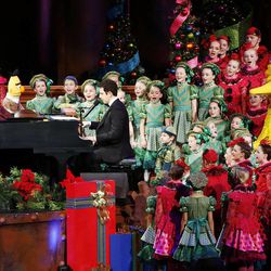 Santino Fontana and the "Sesame Street" Muppets perform with the Mormon Tabernacle Choir during the choir's annual Christmas concert in Salt Lake City Thursday, Dec. 11, 2014.