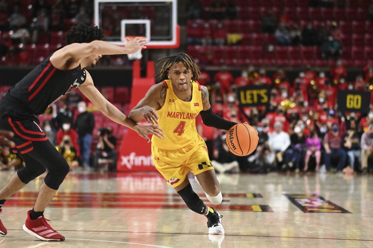 Maryland Terrapins guard Fatts Russell makes a move to the basket as Rutgers Scarlet Knights guard Geo Baker defends during the second half at Xfinity Center.