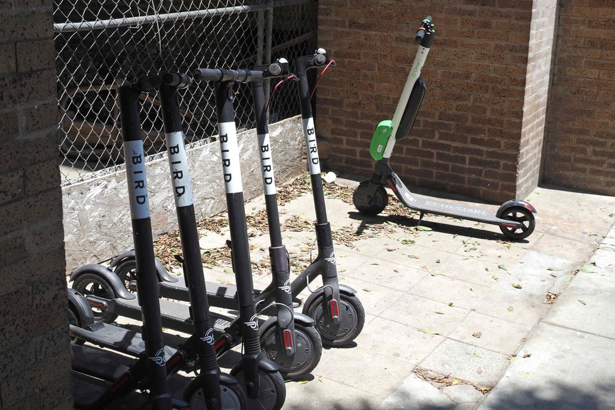 In this file photo taken on July 13, 2018 shared electric scooters are parked on a street in Santa Monica, California.