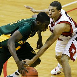 Baylor's Ekpe Udoh, left, tries to drive past Nebraska's Ryan Anderson, in the first half.