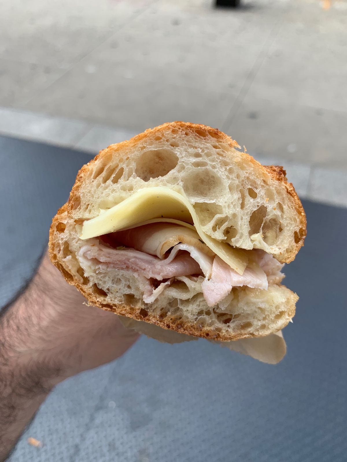 The side view of a ham-and-cheese baguette from Arcade Bakery