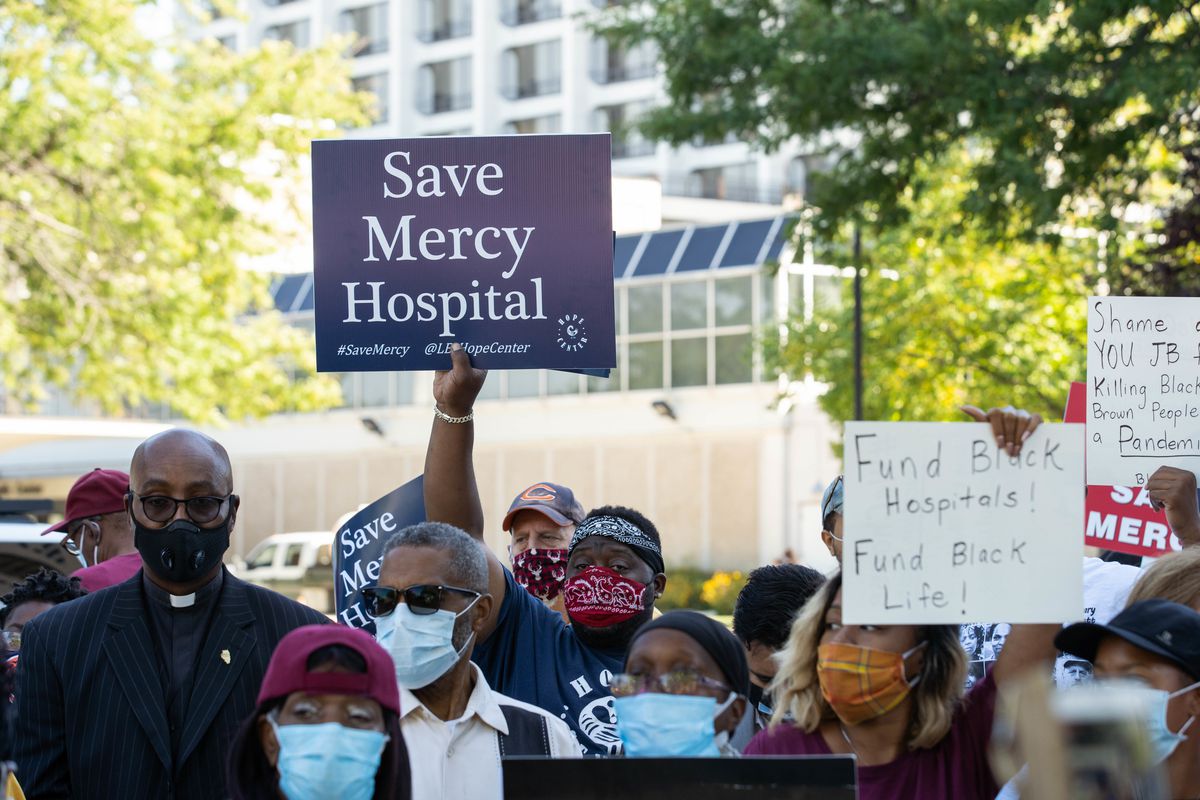 Local officials, community activists and Mercy Hospital and Medical Center employees attend a protest outside Mercy Hospital and Medical Center in Bronzeville Thursday morning, Sept. 3, 2020.