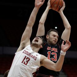 Utah forward David Collette, right, grabs a rebound over Washington State forward Jeff Pollard during the first half of an NCAA college basketball game Saturday, Feb. 17, 2018, in Pullman, Wash. (AP Photo/Ted S. Warren)