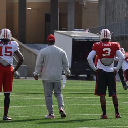 Robert Wheelwright (15) and Serge Trezy (3) watch special teams drills Friday