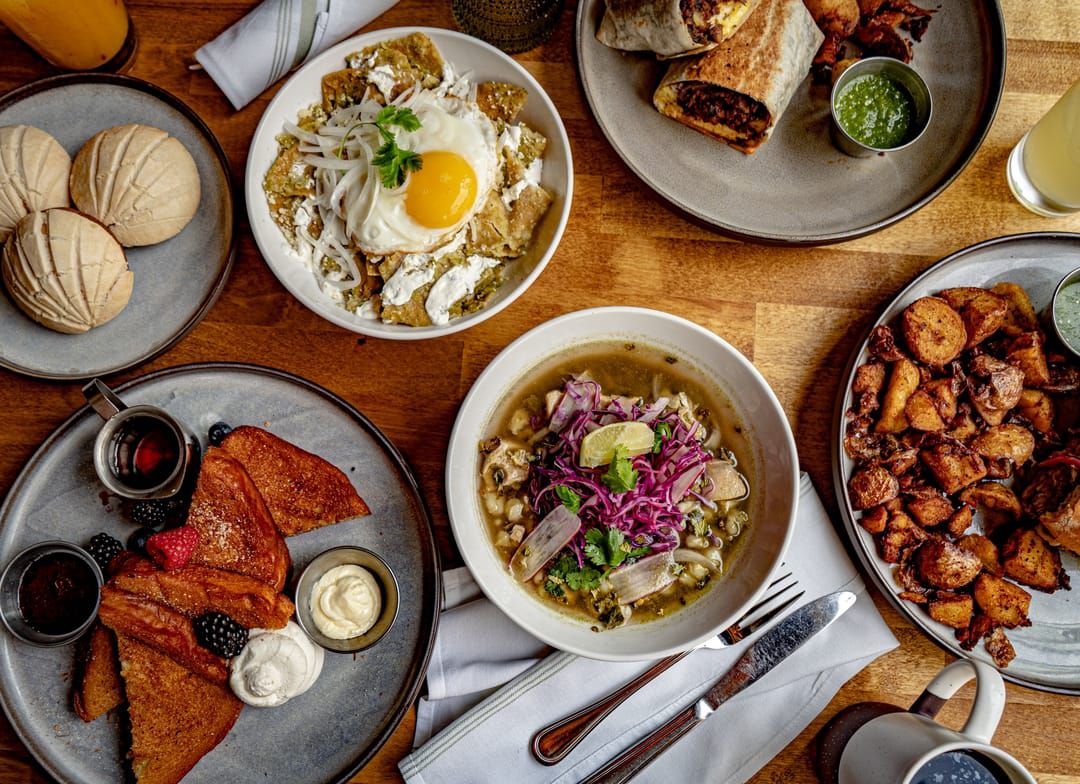 A variety of brunch dishes spread out on a table.