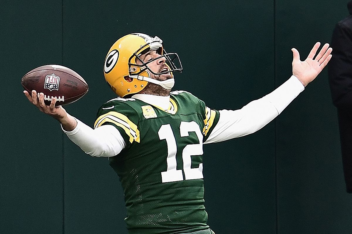 Aaron Rodgers #12 of the Green Bay Packers celebrates scoring his first running touchdown of the season in the 2nd quarter against the Jacksonville Jaguars at Lambeau Field on November 15, 2020 in Green Bay, Wisconsin.