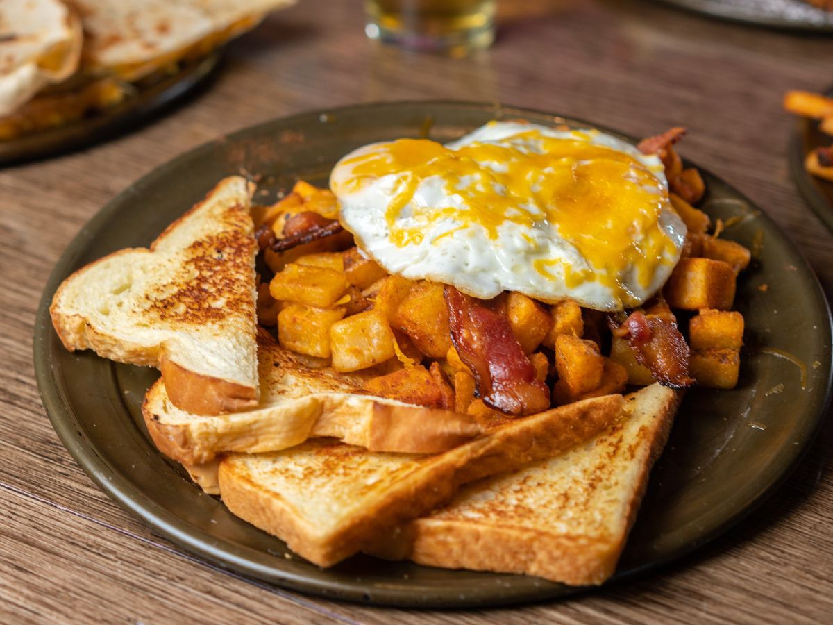 two eggs any style with choice of applewood smoked bacon, sausage, pulled pork, or pulled chicken and home fries
