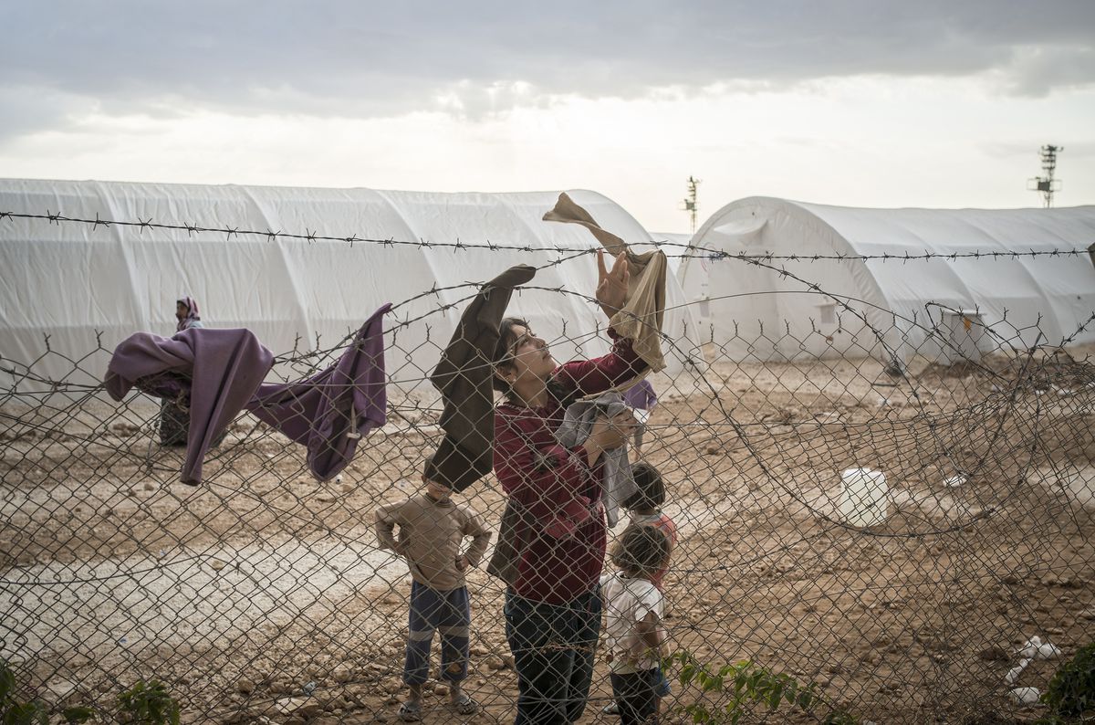 kurdish refugees barbed wire camp