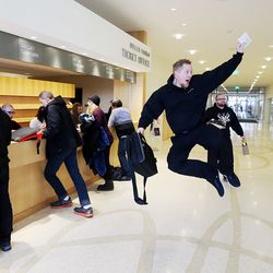 John Butterfield jumps into the air after getting tickets to "Hamilton" at the George S. and Dolores Doré Eccles Theater in Salt Lake City on Friday, Feb. 9, 2018.