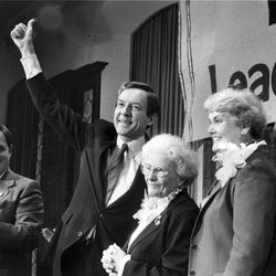 Sen. Orrin Hatch, R-Utah, with his mother, wife and son at his side, gives party faithful thumbs-up sign on election night 1982.