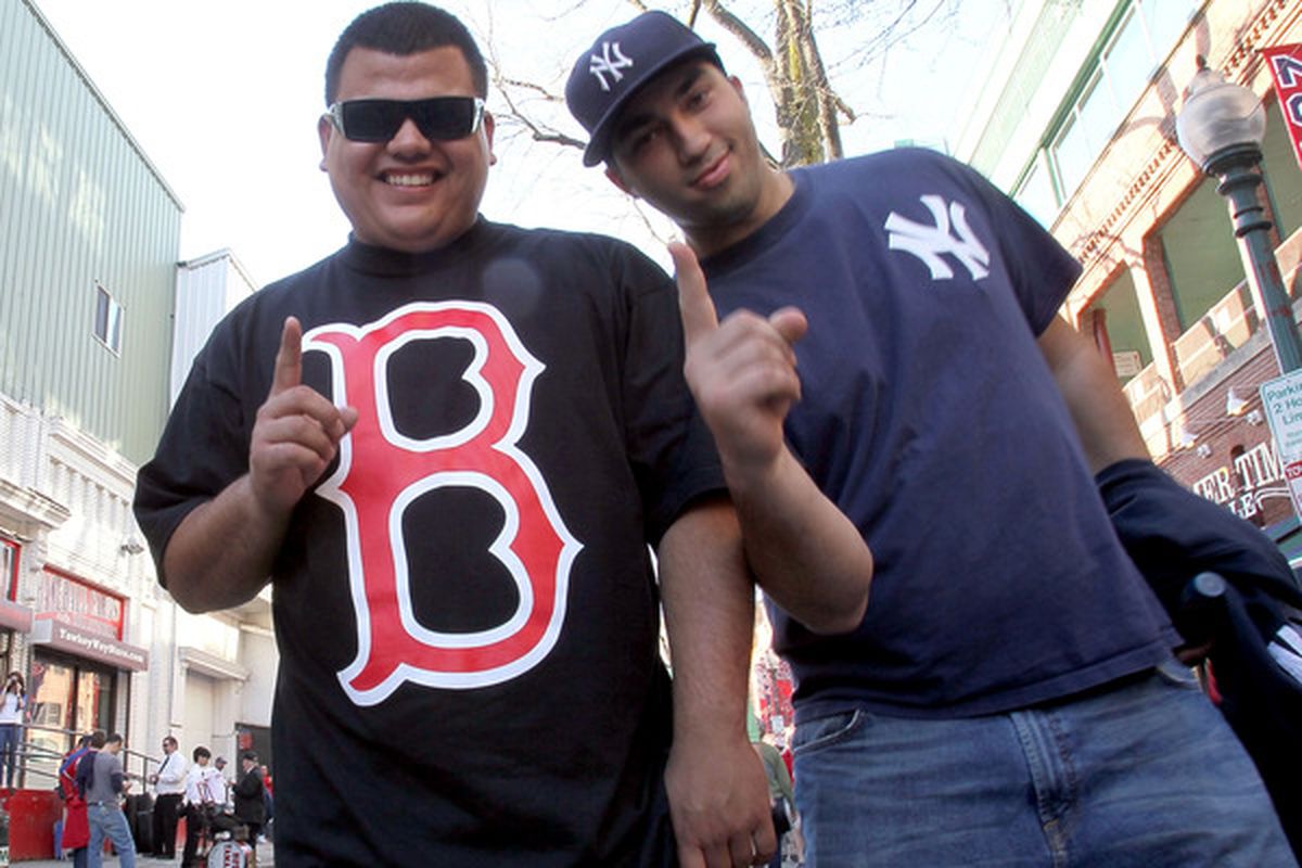 Fans enter Yawkey Way before a game between the Boston Red Sox and the New York Yankees on Opening Night at Fenway Park on April 4, 2010 in Boston, Massachusetts. (Photo by Jim Rogash/Getty Images)