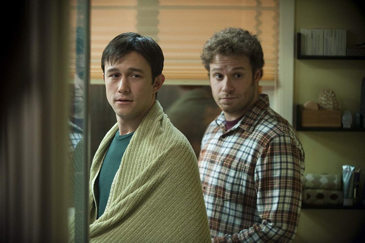 Adam (Joseph Gordon-Levitt) and Kyle (Seth Rogen) look into a bathroom mirror in a screenshot from 50/50