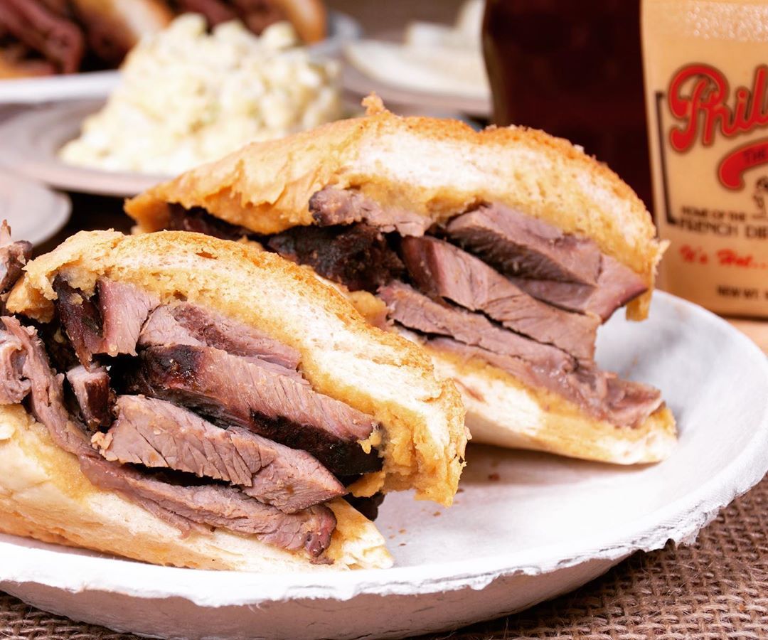 A French dip sandwich on a plate from the L.A. restaurant Philippe The Original. 