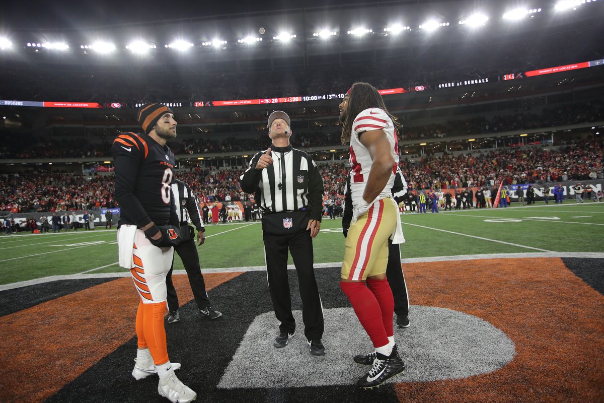 Captains of the San Francisco 49ers and the Cincinnati Bengals at midfield during the coin toss before the start of overtime of the game at Paul Brown Stadium on December 12, 2021 in Cincinnati, Ohio. The 49ers defeated the Bengals 26-23.