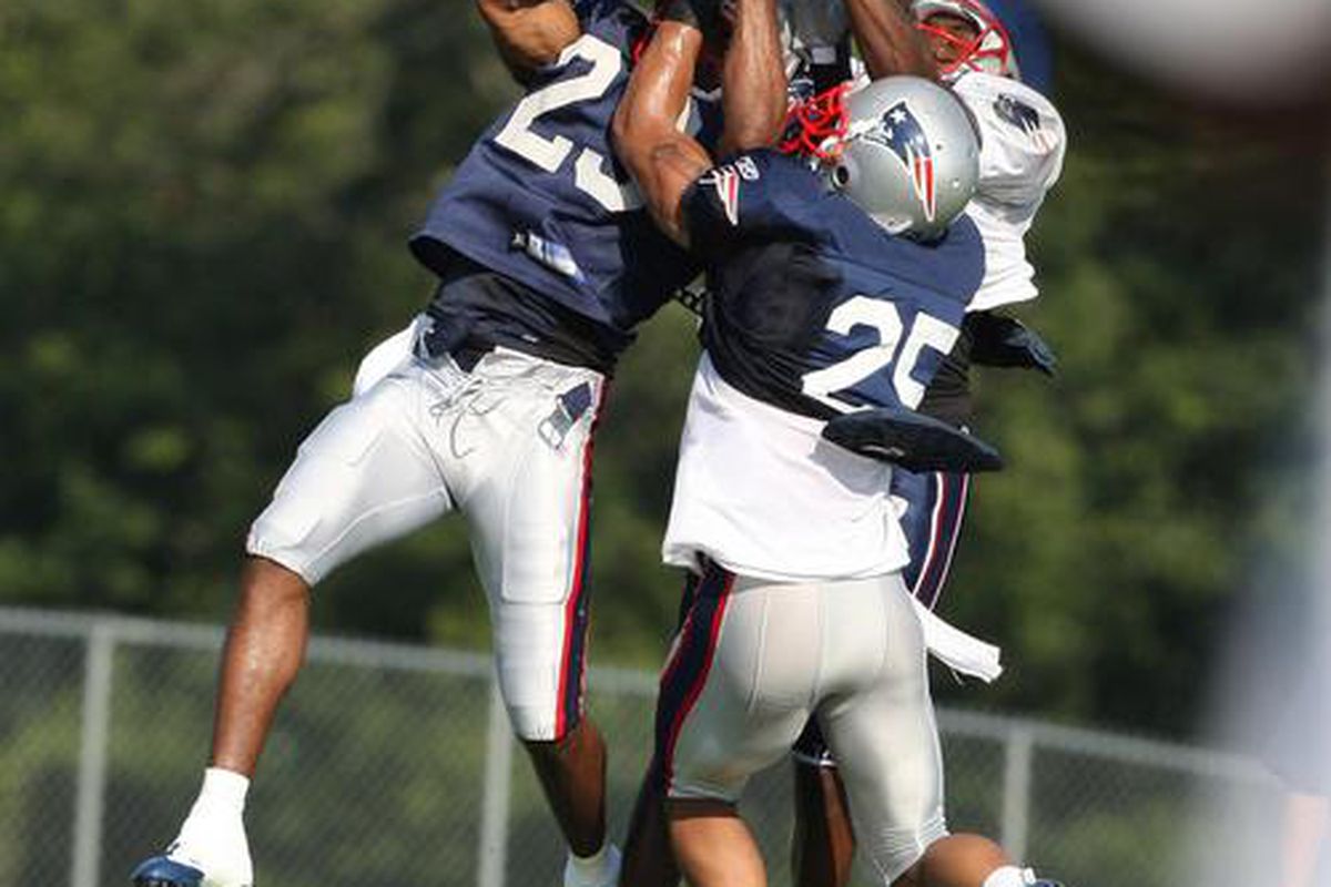 <em>Patriots cornerbacks Leigh Bodden (23) and Patrick Chung team up to force an interception during the afternoon training camp practice session. Chung ended up with the ball. Saturday, August 1, 2009.</em>