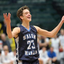 Salem Hills' Cole Griffin motions to the crowd to cheer during the 4A semifinal boys basketball game against Sky View at the UCCU Center in Orem on Friday, March 2, 2018. Salem Hills won 70-60.