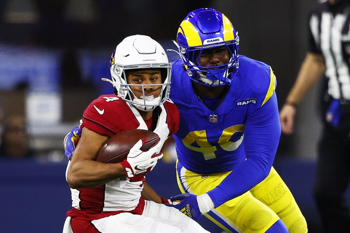 Rondale Moore #4 of the Arizona Cardinals carries the ball past Von Miller #40 of the Los Angeles Rams during the third quarter in the NFC Wild Card Playoff game at SoFi Stadium on January 17, 2022 in Inglewood, California.