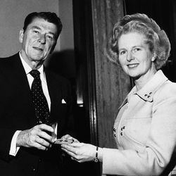 FILE - In this April 9, 1975 file photo, former California Governor Ronald Reagan presents a silver dollar medallion to Opposition Leader Margaret Thatcher when he visited her office at the House of Commons in London.  Ex-spokesman Tim Bell says that Thatcher has died. She was 87. Bell said the woman known to friends and foes as "the Iron Lady" passed away Monday morning, April 8, 2013. 
