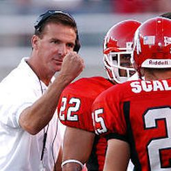 University of Utah football coach Urban Meyer pumps up his team as they play Utah State University in their 2003 season opener on Aug. 28, 2003, at Rice Eccles Stadium. One year later, the Utes are entering the season as defending conference champions with high expectations for the future.