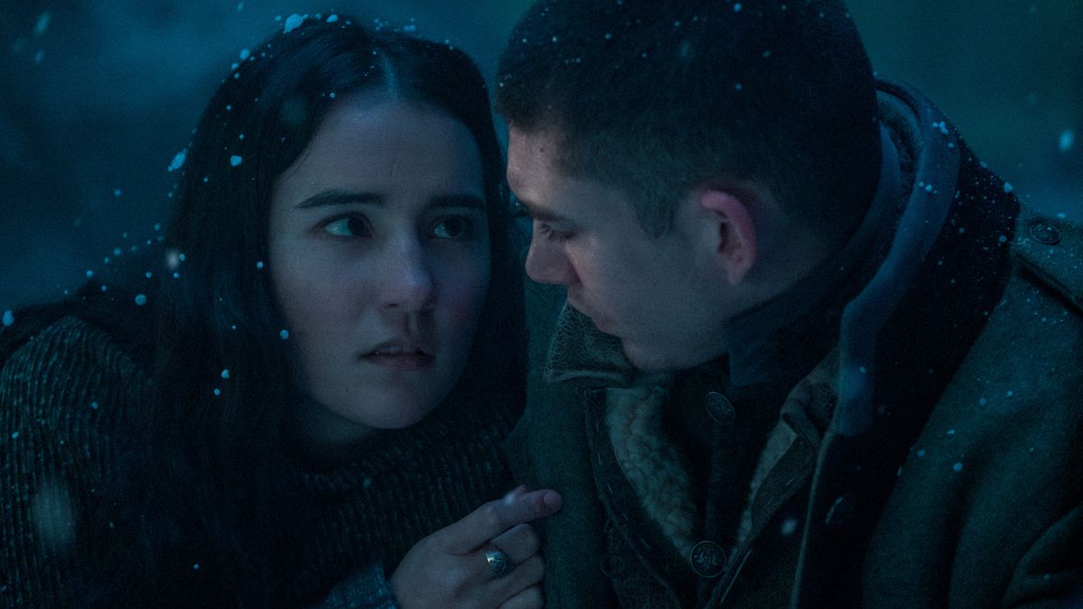 Mal and Alina cuddling for warmth in the snow in Netflix’s Shadow and Bone