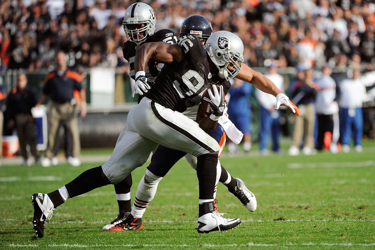 OAKLAND, CA - NOVEMBER 27:  Kamerion Wimbley #96 of the Oakland Raiders returns an interception seventy four yards against the Chicago Bears at O.co Coliseum on November 27, 2011 in Oakland, California.  (Photo by Thearon W. Henderson/Getty Images)