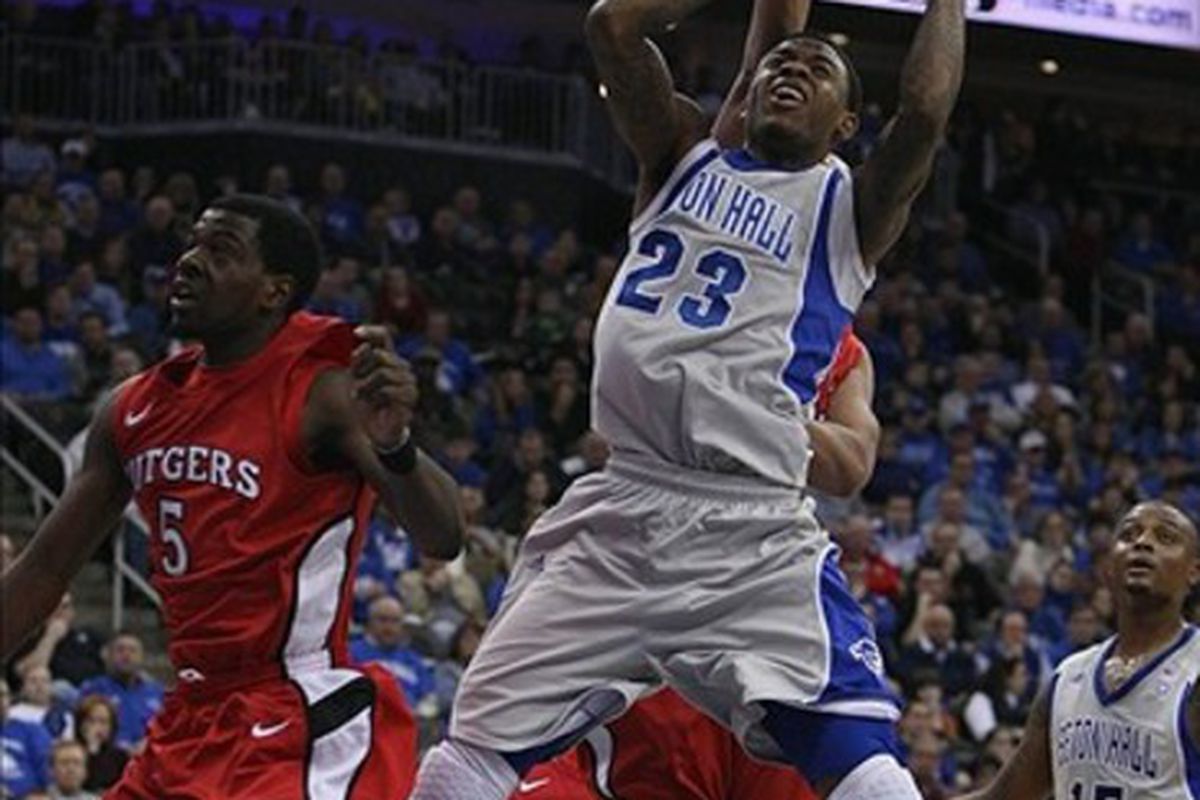 Feb 25 2012; Newark, NJ, USA; Seton Hall Pirates guard/forward Fuquan Edwin (23) is fouled by a Rutgers Scarlet Knights player from behind during the first half at the Prudential Center.  Mandatory Credit: Alan Maglaque-US PRESSWIRE