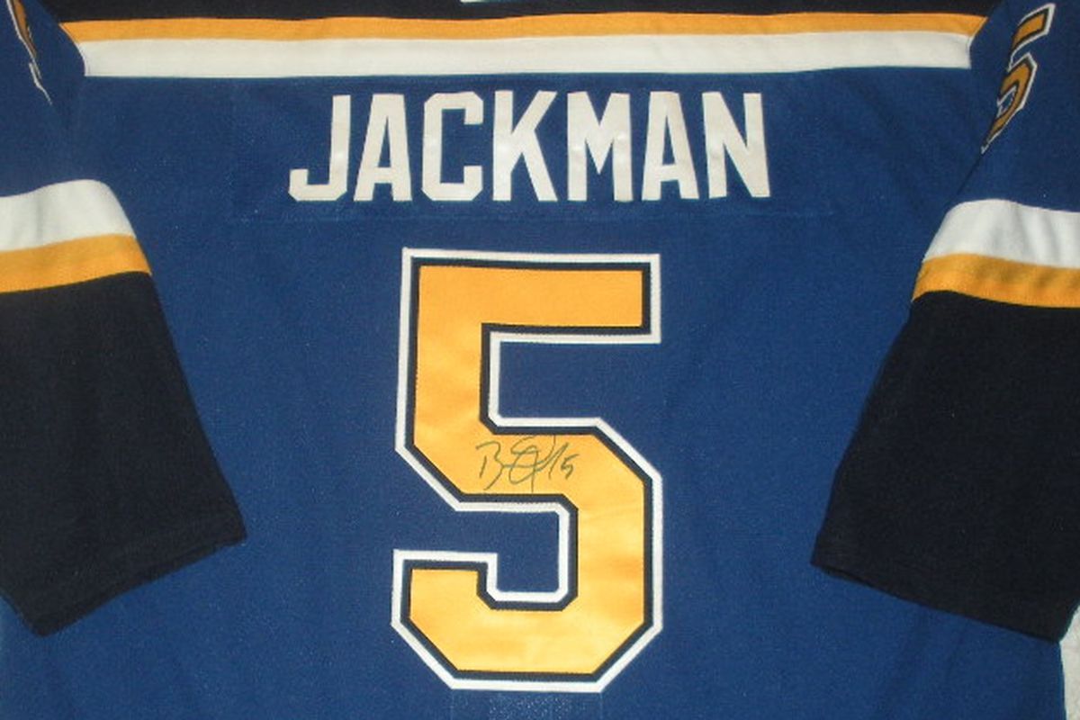 Signed game worn Barret Jackman 2006-07 Blues jersey; Brett Hull retirement patch on front