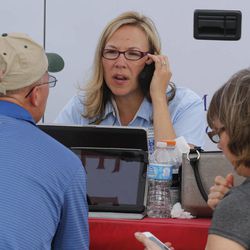 Farm Bureau insurance agent Tanya Morrison, center,  helps a couple that lost their home in the Black Forest wildfire in Colorado Springs, Colo., on Thursday, June 13, 2013. Over 350 homes have been destroyed by the fire since in broke out on Tuesday. 
