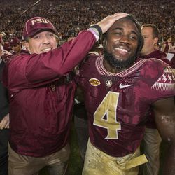 FILE - In this Nov. 26, 2016, file photo, Florida State coach Jimbo Fisher and running back Dalvin Cook celebrate the team's 31-13 win over Florida in an NCAA college football game in Tallahassee, Fla. Cook was selected to the 2016 AP All-America college football team, Monday, Dec. 12, 2016. 