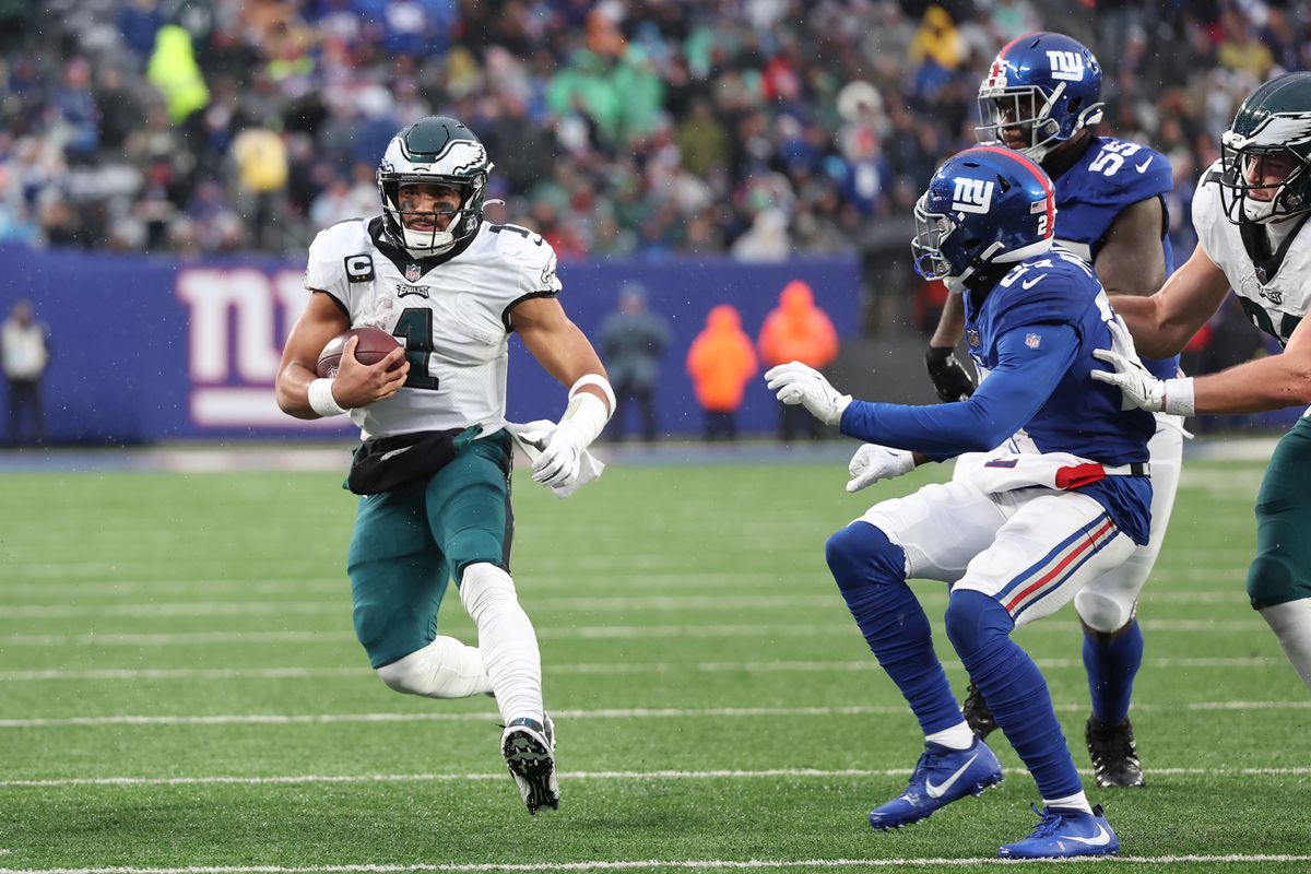 Jalen Hurts #1 of the Philadelphia Eagles runs the ball for a touchdown during the third quarter against the New York Giants at MetLife Stadium on December 11, 2022 in East Rutherford, New Jersey.