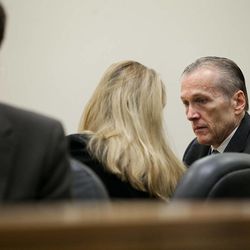 Martin MacNeill, right, speaks with his attorneys before proceedings at 4th District Court in Provo Wednesday, Oct. 30, 2013. MacNeill is charged with murder for allegedly killing his wife, Michele MacNeill, in 2007.