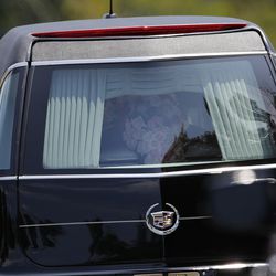 FILE- In this Aug. 1, 2015 file photo, a hearse caring the casket of Bobbi Kristina Brown leaves her funeral service in Alpharetta, Ga. A judge in Atlanta has granted a television station's request to unseal the autopsy report for Bobbi Kristina Brown. The 22-year-old daughter of Houston was found face-down and unresponsive in a bathtub in her suburban Atlanta townhome Jan. 31, 2015, and died in hospice care July 26. (AP Photo/John Bazemore, File)