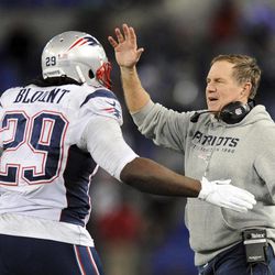 New England Patriots head coach Bill Belichick, right, celebrates with running back LeGarrette Blount after Blount scored a touchdown in the second half of an NFL football game against the Baltimore Ravens, Sunday, Dec. 22, 2013, in Baltimore. 