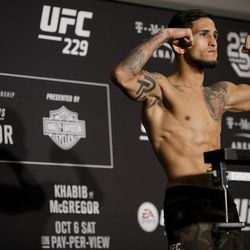 Sergio Pettis poses after making weight at UFC 229 weigh-ins.