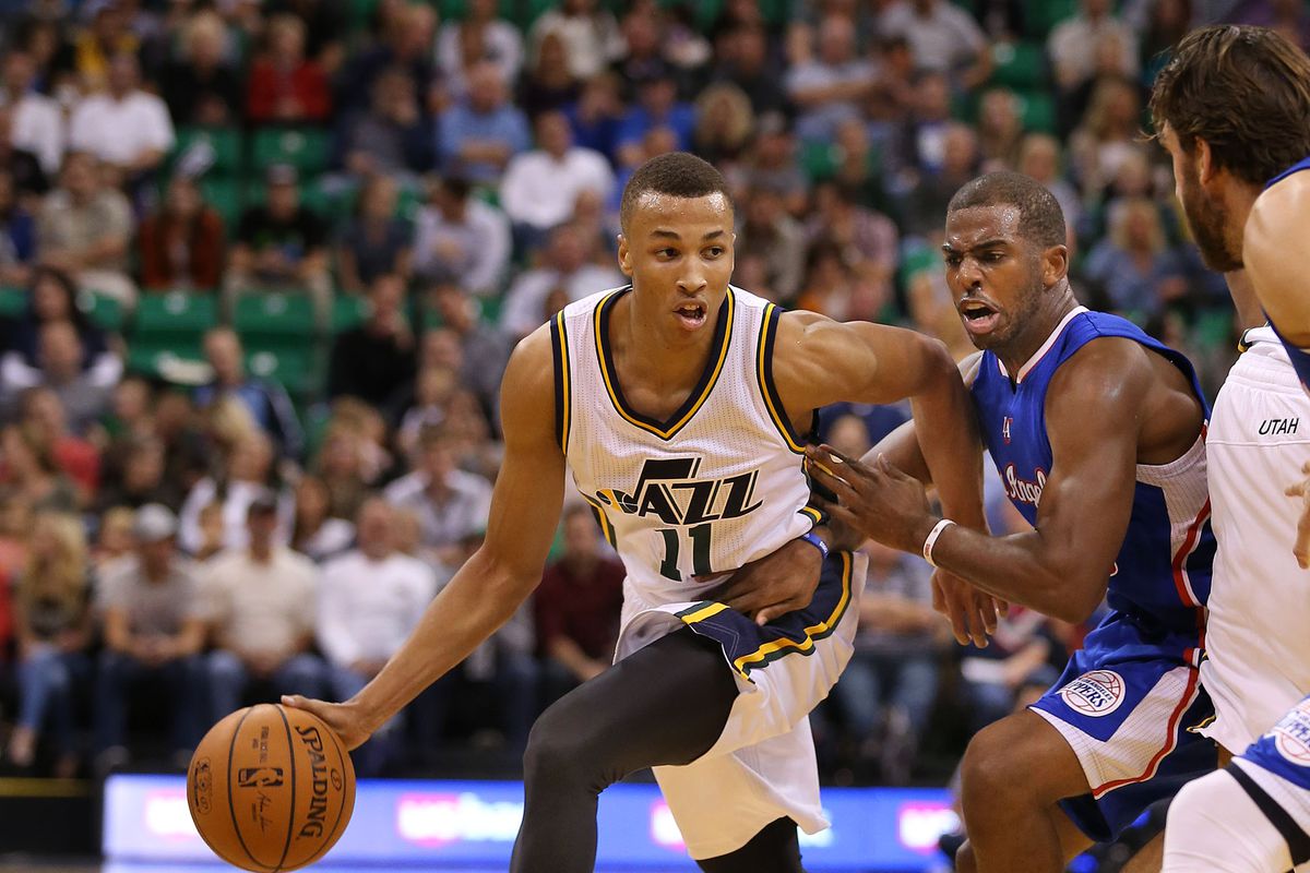 Utah Jazz guard Dante Exum (11) dribbles past Clipper’s Chris Paul as the Utah Jazz defeat the Clippers 102-89 as they play pre-season NBA basketball Monday, Oct. 13, 2014, in Salt Lake City.