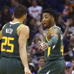 Utah Jazz guard Donovan Mitchell, right, celebrates his 3-pointer against the Phoenix Suns with Jazz guard Raul Neto (25) during the second half of an NBA basketball Wednesday, April 3, 2019, in Phoenix. The Jazz won 118-97. (AP Photo/Ross D. Franklin)