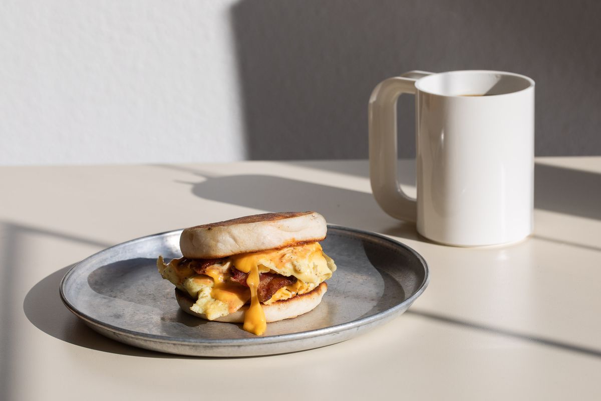 A breakfast sandwich on a plate.