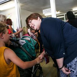 Midvalley Elementary Principal Tamra Baker greets students and their parents on back-to-school night at the Midvale school on Tuesday, Aug. 22, 2017. The school has several outdated features including the entryway, which cannot be made compliant with the Americans with Disabilities Act. Students in wheelchairs must use an alternate entry on another side of the school that is monitored by video cameras so they can be buzzed in.