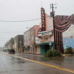 A single truck drives down a street as Hurricane Harvey makes landfall in downtown Port Lavaca, Texas on Friday, Aug. 25, 2017. Hurricane Harvey smashed into Texas late Friday, lashing a wide swath of the Gulf Coast with strong winds and torrential rain from the fiercest hurricane to hit the U.S. in more than a decade. 