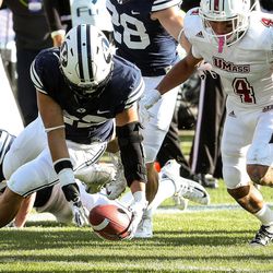 Brigham Young Cougars defensive back Hiva Lee (22) recovers a kickoff return fumble during a game against the UMass Minutemen at LaVell Edwards Stadium in Provo on Saturday, Nov. 19, 2016.