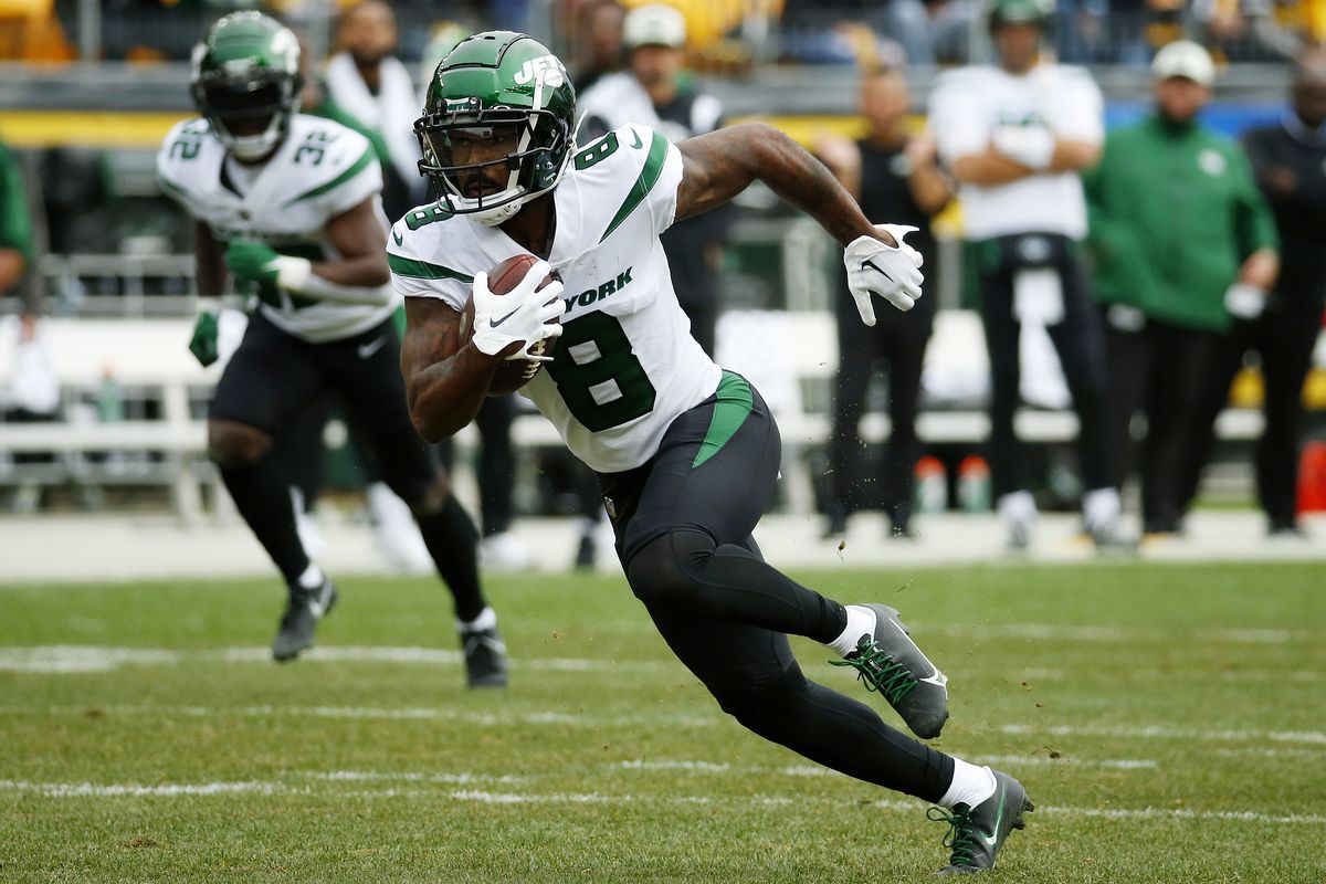 Elijah Moore #8 of the New York Jets runs with the ball in the first quarter against the Pittsburgh Steelers at Acrisure Stadium on October 02, 2022 in Pittsburgh, Pennsylvania.