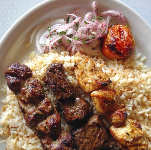 Kebabs and rice from Marouch with onions and tomato.