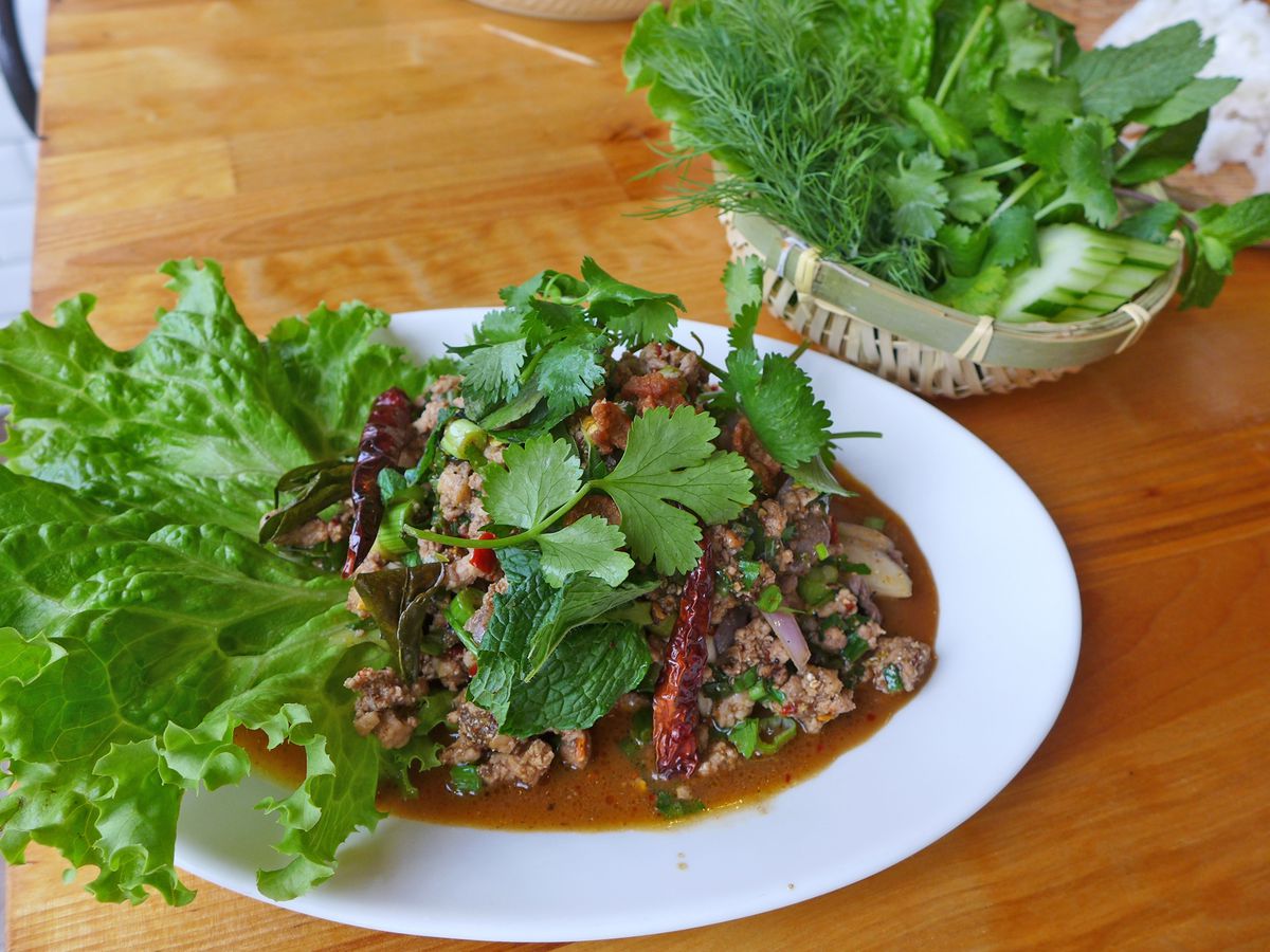 A duck salad with lots of herbs. 